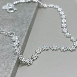 Armbnd LOTS OF FLOWERS sterling slv