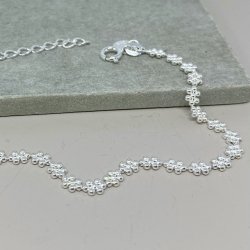 Armbnd LOTS OF FLOWERS sterling slv