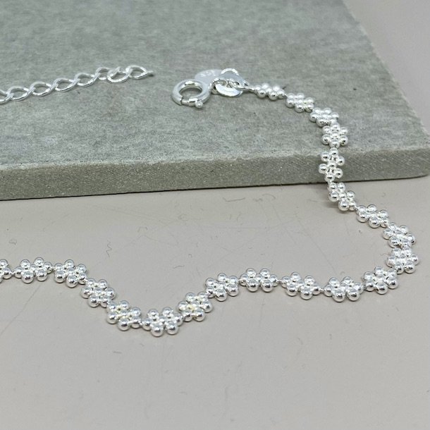 Armbnd LOTS OF FLOWERS sterling slv