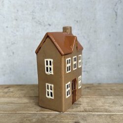 Hus til fyrfadslys brun