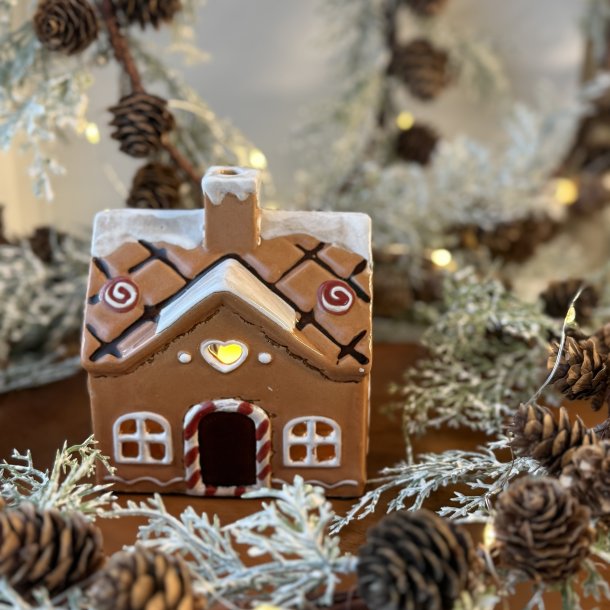 Hus til fyrfadslys keramik