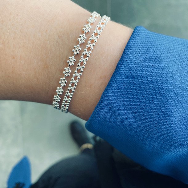 Armbnd LOTS OF FLOWERS sterling slv