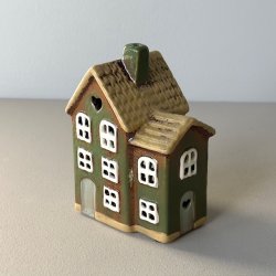 Hus til fyrfadslys keramik