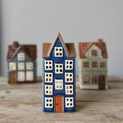 Hus til fyrfadslys bl keramik