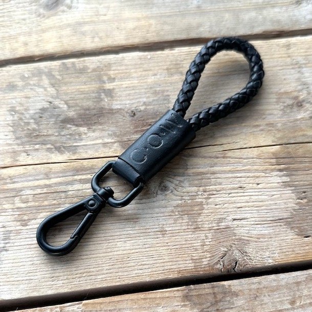 Kort nglesnor til nglering COW - flettet skind black